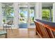 Inviting living room featuring french doors to the porch and views of the waterfront at 206 S Riverside Dr, Edgewater, FL 32132