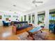 Open living room featuring hardwood floors, bright windows, and waterfront views at 206 S Riverside Dr, Edgewater, FL 32132