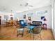 Bright living room featuring hardwood floors, white walls, stylish decor, and a ceiling fan at 206 S Riverside Dr, Edgewater, FL 32132