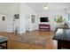 Open living room with hardwood floors, a ceiling fan, and natural light at 206 S Riverside Dr, Edgewater, FL 32132
