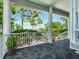 Charming outdoor patio area featuring tile flooring and views of the lush green landscape at 206 S Riverside Dr, Edgewater, FL 32132