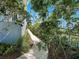 Landscaped side yard with a pathway at 206 S Riverside Dr, Edgewater, FL 32132