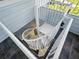 Bright white spiral staircase ascends with tile floors, showcasing modern design and natural light at 206 S Riverside Dr, Edgewater, FL 32132