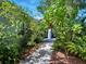 Charming brick walkway surrounded by lush landscaping, creating a serene and inviting path at 206 S Riverside Dr, Edgewater, FL 32132