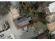 Aerial view of a property outlining its boundaries with surrounding homes and showing the roof and yard condition at 215 Alma Ct, New Smyrna Beach, FL 32168
