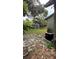 The backyard has a tool shed in addition to the back of the house at 215 Alma Ct, New Smyrna Beach, FL 32168