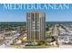 Aerial view of oceanfront condo community with lush landscaping and nearby amenities at 2300 N Atlantic Ave # 203, Daytona Beach, FL 32118