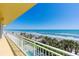 Stunning ocean view from the condo balcony, lined with palm trees, perfect for relaxing at 2300 N Atlantic Ave # 203, Daytona Beach, FL 32118