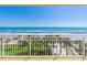 Breathtaking ocean view from the balcony, featuring palm trees, perfect for enjoying coastal living at 2300 N Atlantic Ave # 203, Daytona Beach, FL 32118