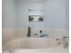 Bathroom with a jet tub and decorative seashore accents at 2300 N Atlantic Ave # 203, Daytona Beach, FL 32118
