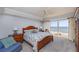Bright bedroom with wooden furnishings and a beautiful ocean view from the private balcony at 2300 N Atlantic Ave # 203, Daytona Beach, FL 32118
