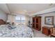 Comfortable bedroom with ocean views, featuring a ceiling fan and neutral-toned walls at 2300 N Atlantic Ave # 203, Daytona Beach, FL 32118