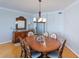 Dining room featuring a wooden table and buffet with a decorative mirror at 2300 N Atlantic Ave # 203, Daytona Beach, FL 32118