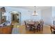 Sunlit dining room featuring a wooden table with seating for six at 2300 N Atlantic Ave # 203, Daytona Beach, FL 32118