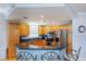 Kitchen features stainless steel appliances, granite counters, and light wood cabinets with ample storage at 2300 N Atlantic Ave # 203, Daytona Beach, FL 32118