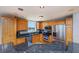 Well-appointed kitchen featuring stainless steel appliances and granite countertops at 2300 N Atlantic Ave # 203, Daytona Beach, FL 32118