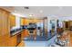 Kitchen with stainless steel appliances, granite countertops, light wood cabinets and a breakfast bar at 2300 N Atlantic Ave # 203, Daytona Beach, FL 32118