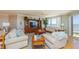 Inviting living room with plush seating, large windows showcasing ocean views, and elegant decor at 2300 N Atlantic Ave # 203, Daytona Beach, FL 32118