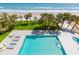 Inviting pool and spa offer relaxation with ocean views and palm trees in this gorgeous real estate setting at 2300 N Atlantic Ave # 203, Daytona Beach, FL 32118