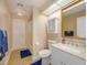 This bathroom features a white vanity, white toilet and shower with tub at 2338 Tuscarora Trl, Maitland, FL 32751