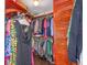 Well-organized walk-in closet with custom wood shelving and ample storage space at 2338 Tuscarora Trl, Maitland, FL 32751