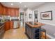 Charming kitchen featuring granite countertops, stainless steel appliances, and tile flooring at 2338 Tuscarora Trl, Maitland, FL 32751