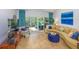 Cozy living room featuring a comfortable sofa, armchair, and sliding glass doors leading to the backyard at 2338 Tuscarora Trl, Maitland, FL 32751
