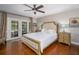 This main bedroom features wood floors, patio access, and plenty of natural light at 2338 Tuscarora Trl, Maitland, FL 32751