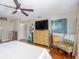 This main bedroom features wood floors and large windows at 2338 Tuscarora Trl, Maitland, FL 32751