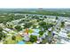 Aerial view of a charming waterfront property, nestled along the serene canals at 235 Randle Ave, Oak Hill, FL 32759
