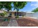 Spacious backyard featuring a deck, screened-in porch and well-maintained landscaping at 235 Randle Ave, Oak Hill, FL 32759