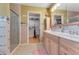 Bathroom features a double sink vanity, walk-in shower, and stylish decor at 235 Randle Ave, Oak Hill, FL 32759