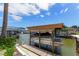 Covered boat lift, with easy access to the waterfront at 235 Randle Ave, Oak Hill, FL 32759