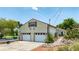 Large two-car garage with room for storage, side-entry door and trailer parking, and extra parking spaces at 235 Randle Ave, Oak Hill, FL 32759