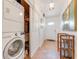 Hallway featuring in-unit laundry and storage at 235 Randle Ave, Oak Hill, FL 32759