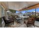 Inviting covered patio featuring comfortable seating and views of the canal at 235 Randle Ave, Oak Hill, FL 32759