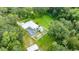 Overhead view featuring the pool, yard, and surrounding mature trees at 2360 Mooneyham Dr, New Smyrna Beach, FL 32168