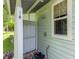 Enclosed outdoor shower area with a wooden floor, rain shower head and privacy walls at 2360 Mooneyham Dr, New Smyrna Beach, FL 32168
