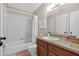 Bright bathroom featuring a vanity, toilet, and shower-tub, providing essential functionality and comfort at 258 W Sabal Palm Pl # 22, Longwood, FL 32779