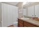 Well-lit bathroom featuring a vanity and bathtub with a shower, exuding cleanliness and practicality at 258 W Sabal Palm Pl # 22, Longwood, FL 32779