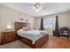 A comfortable bedroom with wood floors, a nightstand, and a relaxing ambiance at 258 W Sabal Palm Pl # 22, Longwood, FL 32779