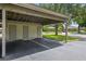 Covered carport providing parking spaces with storage closets for residents convenience at 258 W Sabal Palm Pl # 22, Longwood, FL 32779