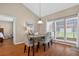 Dining area features vaulted ceilings, hardwood floors, and lots of natural light at 258 W Sabal Palm Pl # 22, Longwood, FL 32779