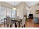 Dining area with seating for four, wood floors, view of fireplace, and natural light at 258 W Sabal Palm Pl # 22, Longwood, FL 32779