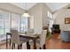 Dining area with seating for four, wood floors, view of fireplace, and natural light at 258 W Sabal Palm Pl # 22, Longwood, FL 32779