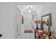 Welcoming entryway with tile floors, decorative accents, and a view of the dining area at 258 W Sabal Palm Pl # 22, Longwood, FL 32779