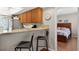 Open concept kitchen with breakfast bar and view to bedroom at 258 W Sabal Palm Pl # 22, Longwood, FL 32779