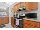 Well-equipped kitchen with modern appliances and ample counter space at 258 W Sabal Palm Pl # 22, Longwood, FL 32779