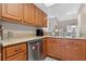 Practical kitchen with stainless steel dishwasher and ample cabinet space at 258 W Sabal Palm Pl # 22, Longwood, FL 32779