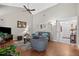 Inviting living room featuring a ceiling fan, neutral walls, and wood flooring, creating a cozy atmosphere at 258 W Sabal Palm Pl # 22, Longwood, FL 32779